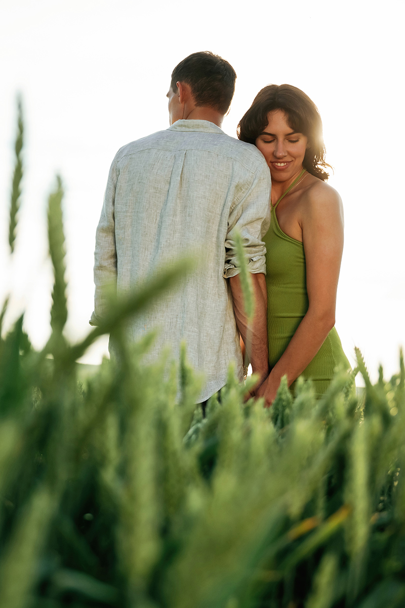 Non urban scene. Lovely couple are on the agricultural field together.